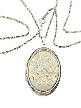 Silver tone oval floral engraved locket pendant on chain necklace vintage flower